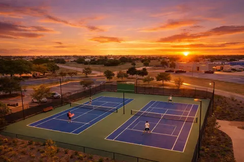 a view of a street with houses on both side of it