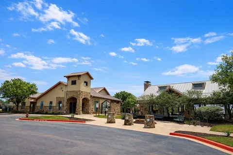 a view of a lake with houses in the back