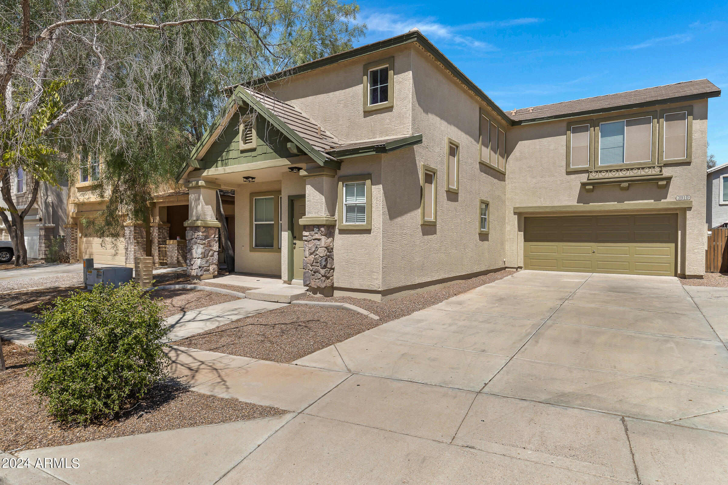 3910 West Carter Road Phoenix, AZ 85041 - Photo 1 of 40 a view of a house with a yard
