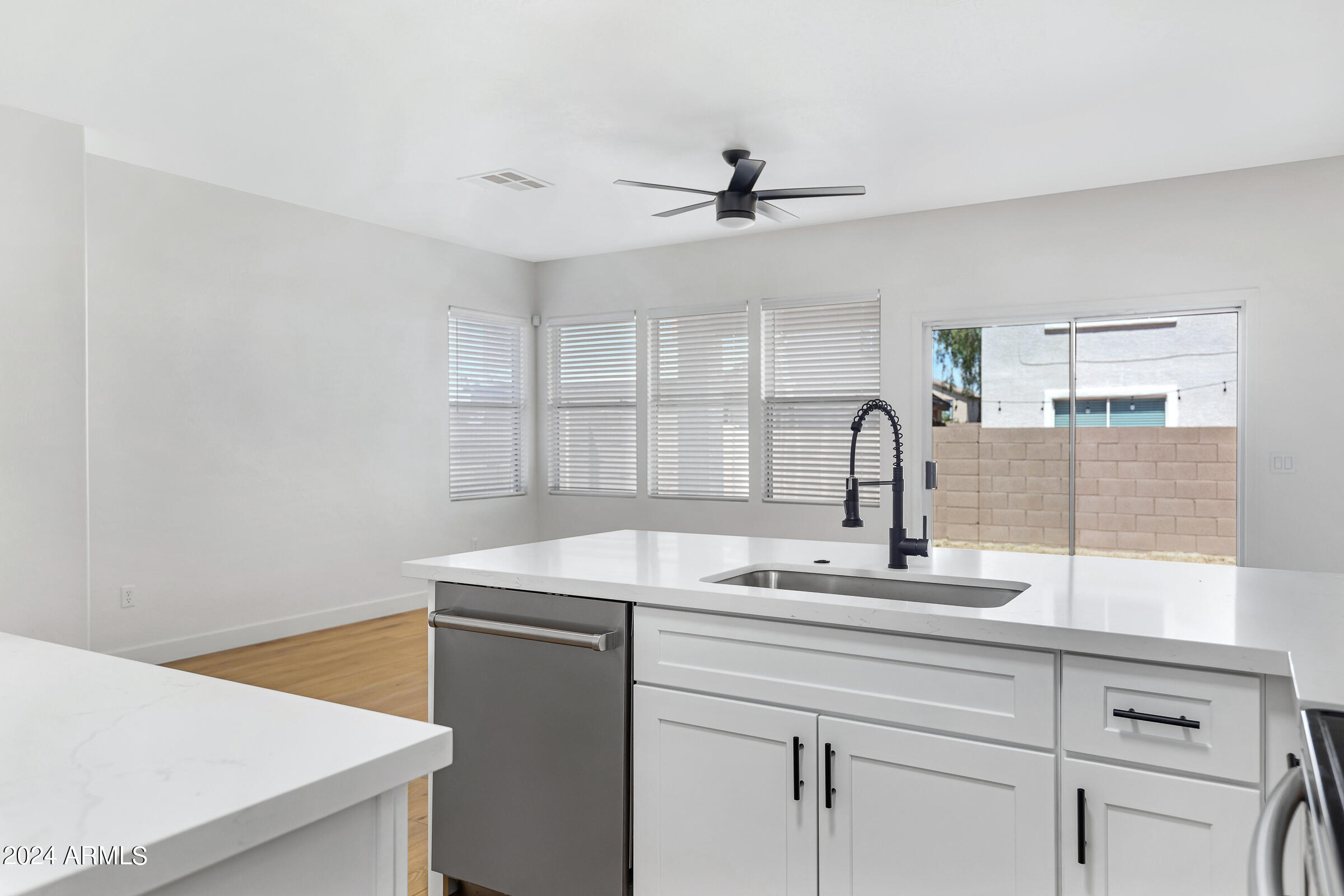 3910 West Carter Road Phoenix, AZ 85041 - Photo 17 of 40 a kitchen with a sink and a refrigerator