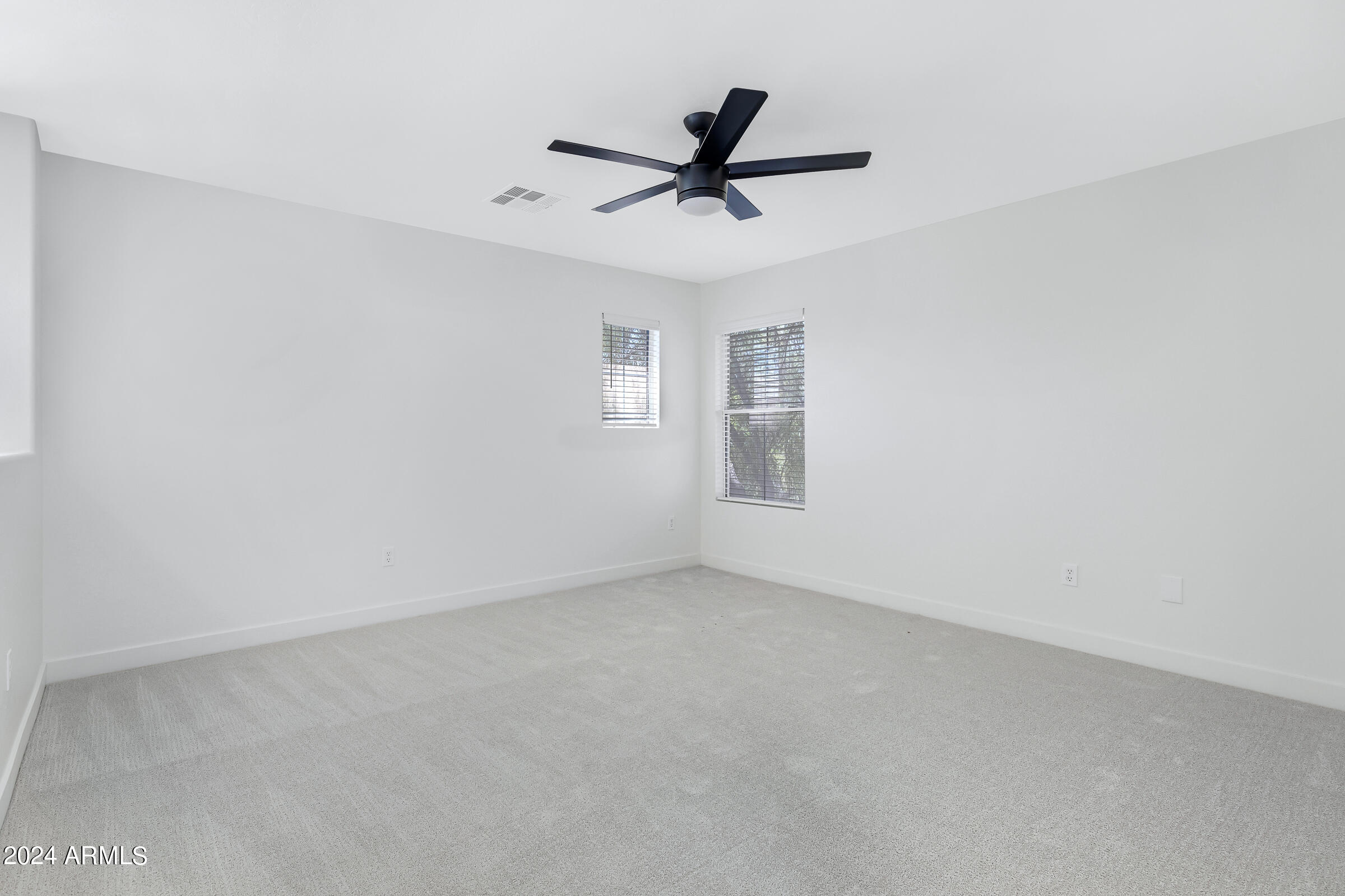 3910 West Carter Road Phoenix, AZ 85041 - Photo 23 of 40 a view of a livingroom with a ceiling fan and window