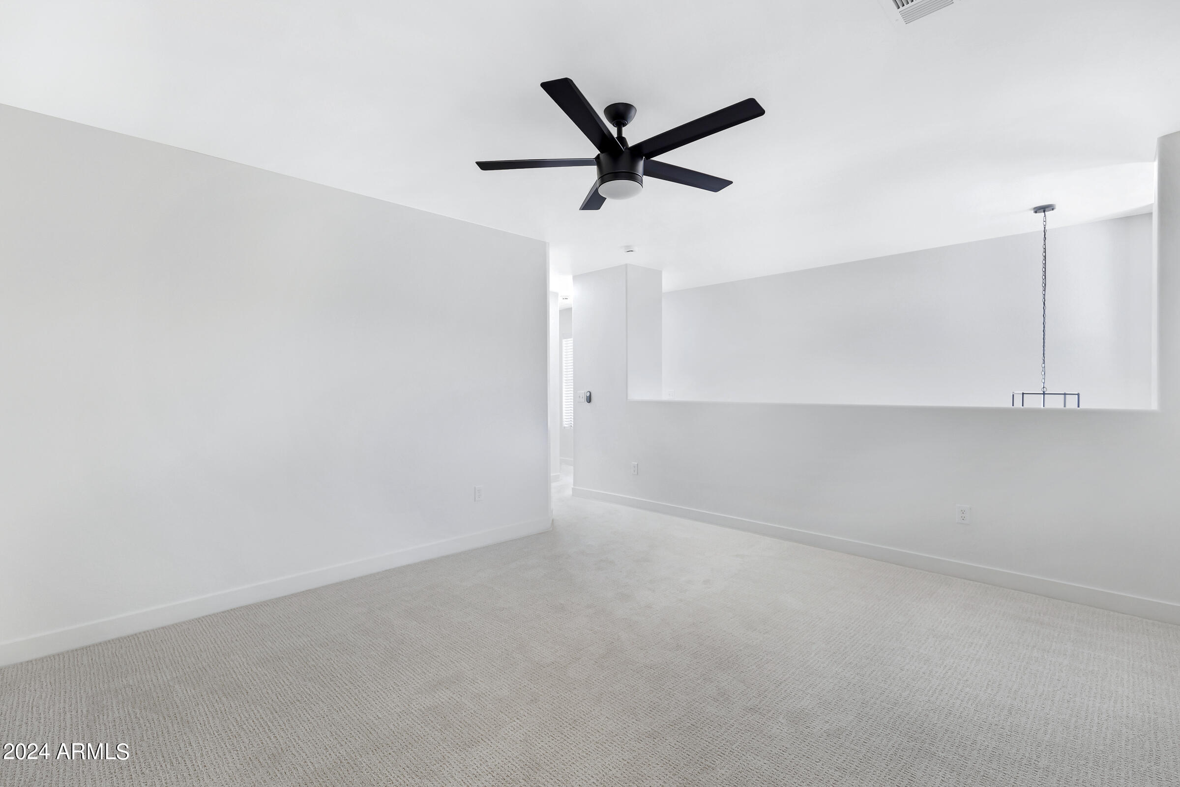 3910 West Carter Road Phoenix, AZ 85041 - Photo 24 of 40 a view of a room with a ceiling fan