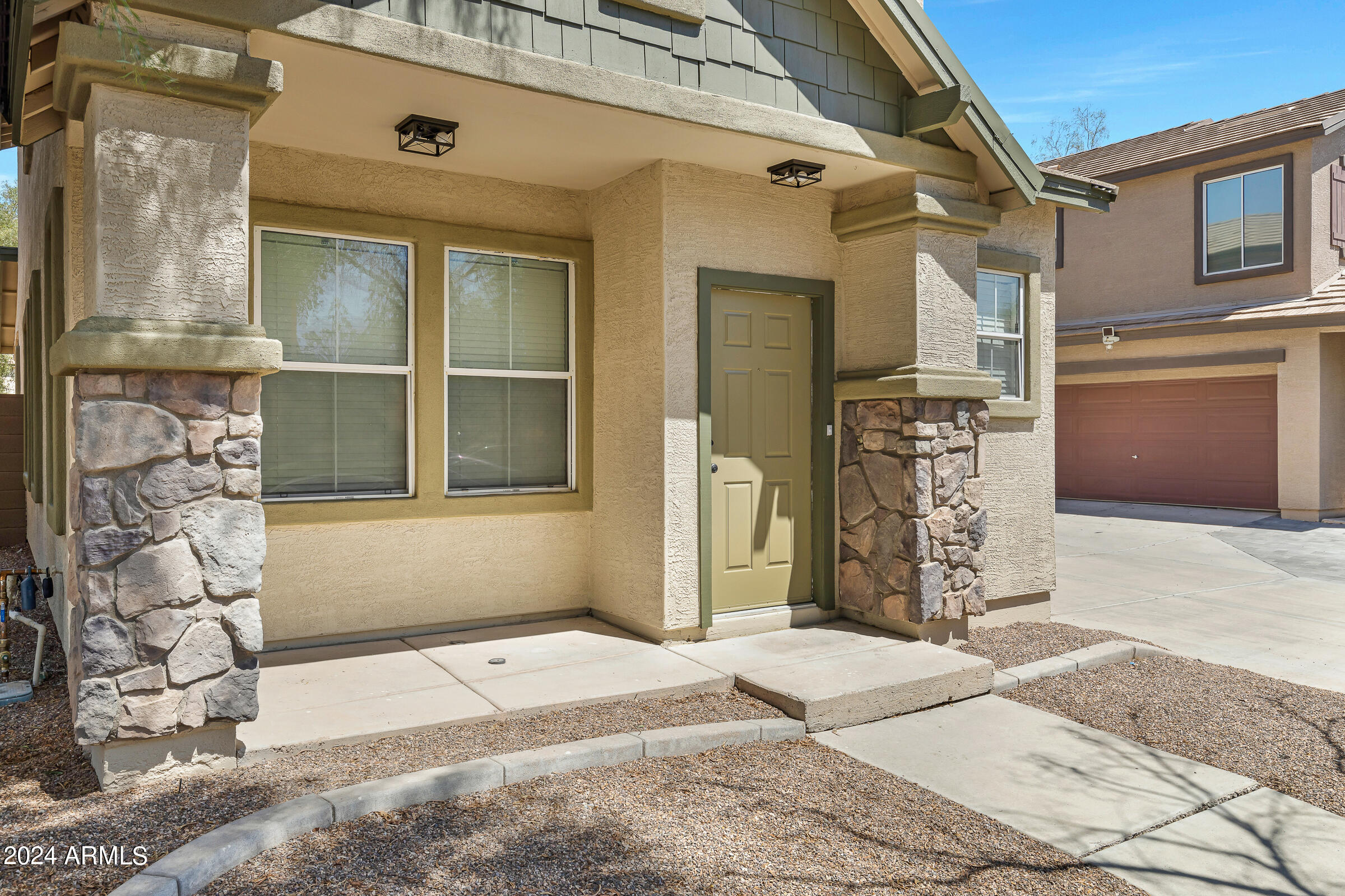 3910 West Carter Road Phoenix, AZ 85041 - Photo 3 of 40 a front view of a house