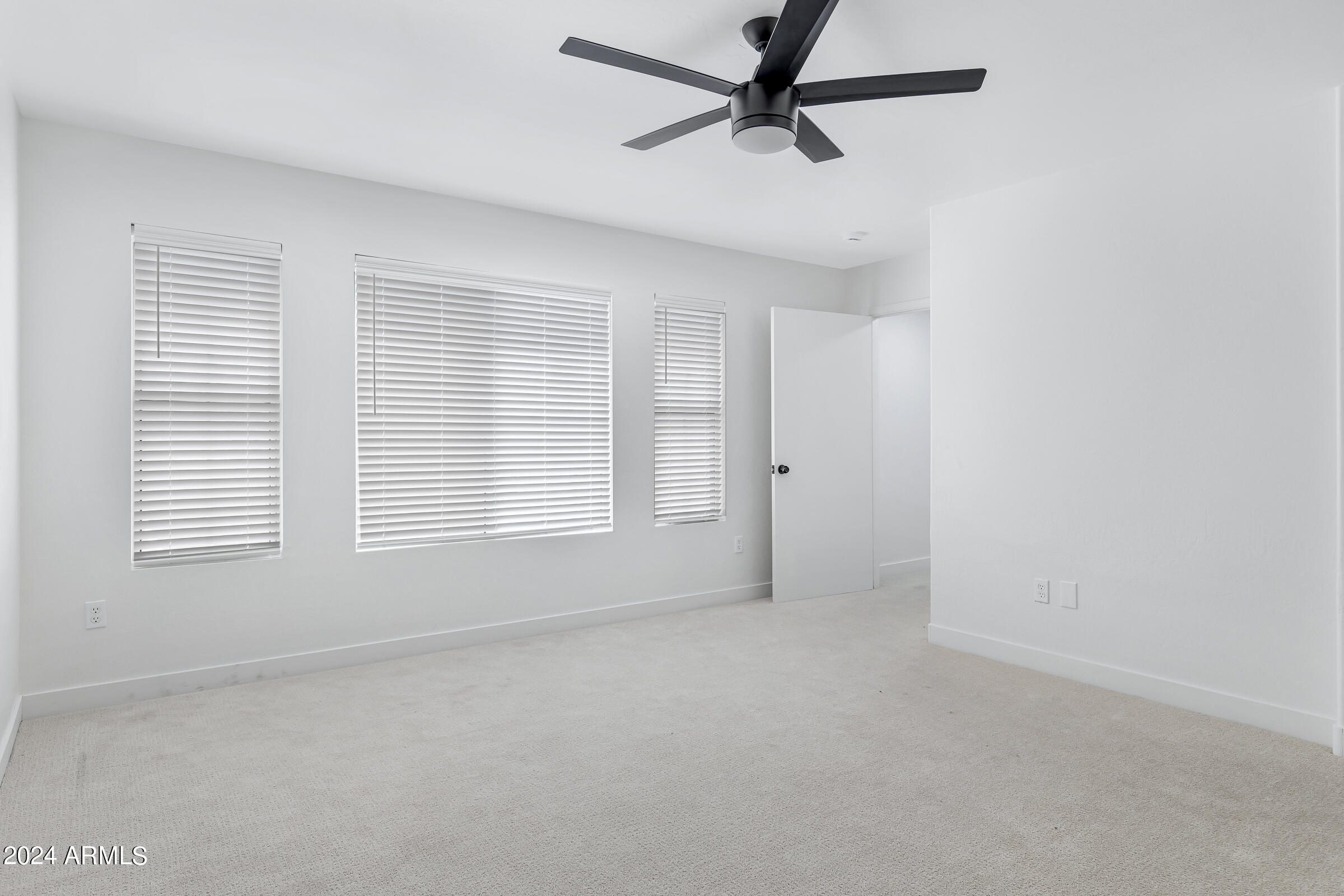 3910 West Carter Road Phoenix, AZ 85041 - Photo 31 of 40 a view of a livingroom with a ceiling fan and window