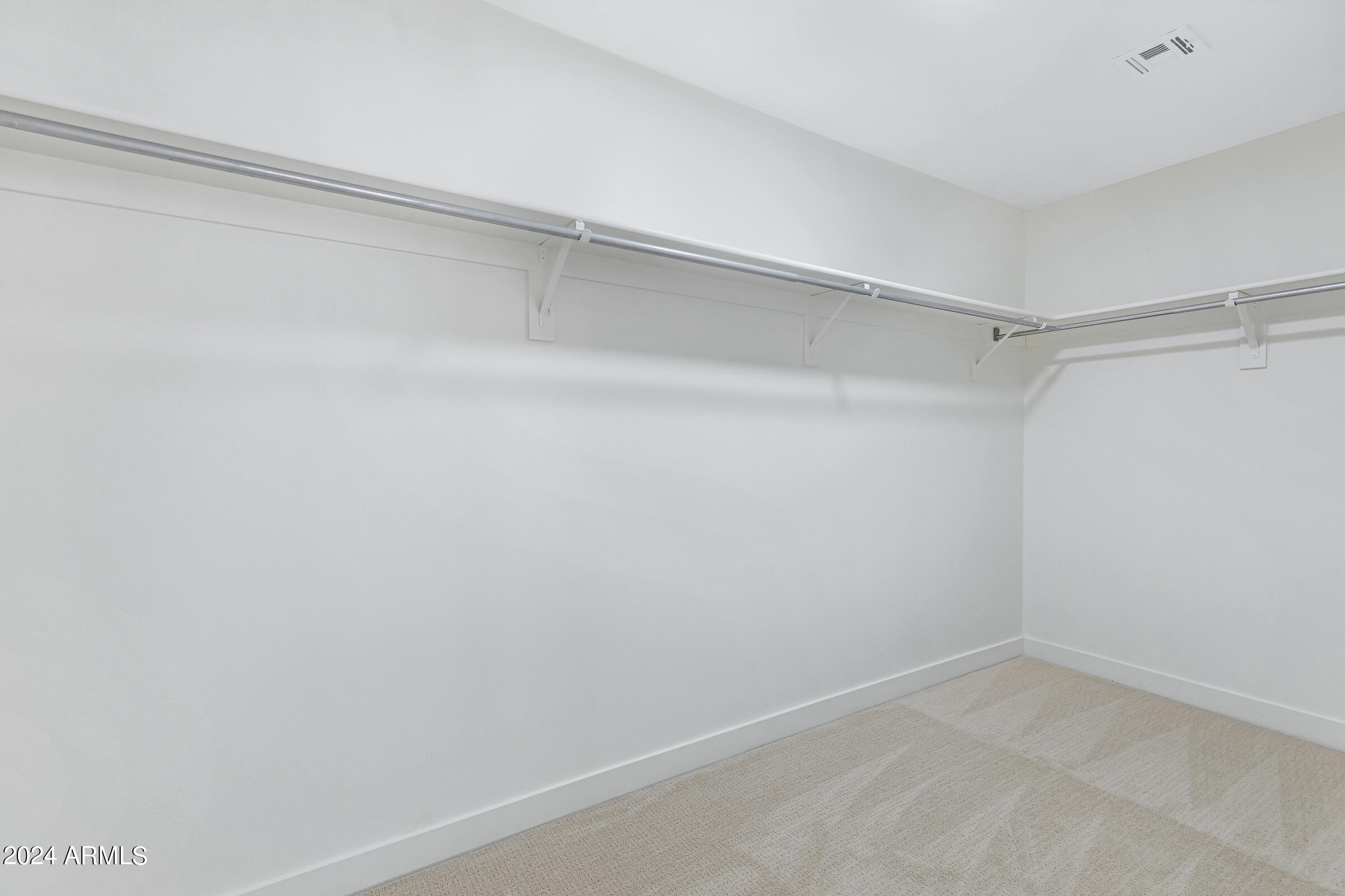 3910 West Carter Road Phoenix, AZ 85041 - Photo 33 of 40 a view of an empty walk in closet