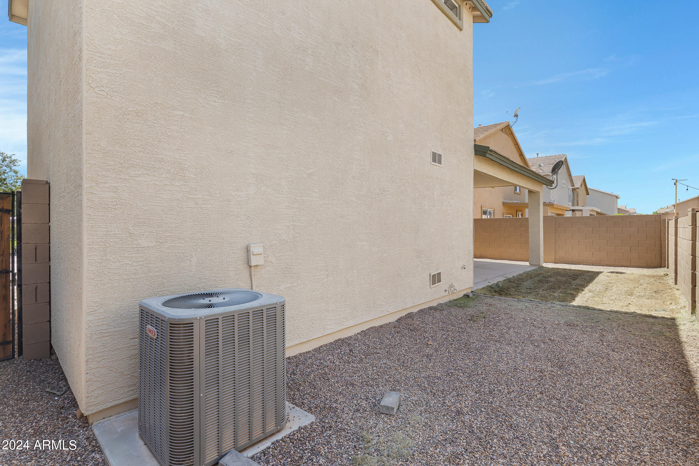 3910 West Carter Road Phoenix, AZ 85041 - Photo 38 of 40 a view of a house with a backyard