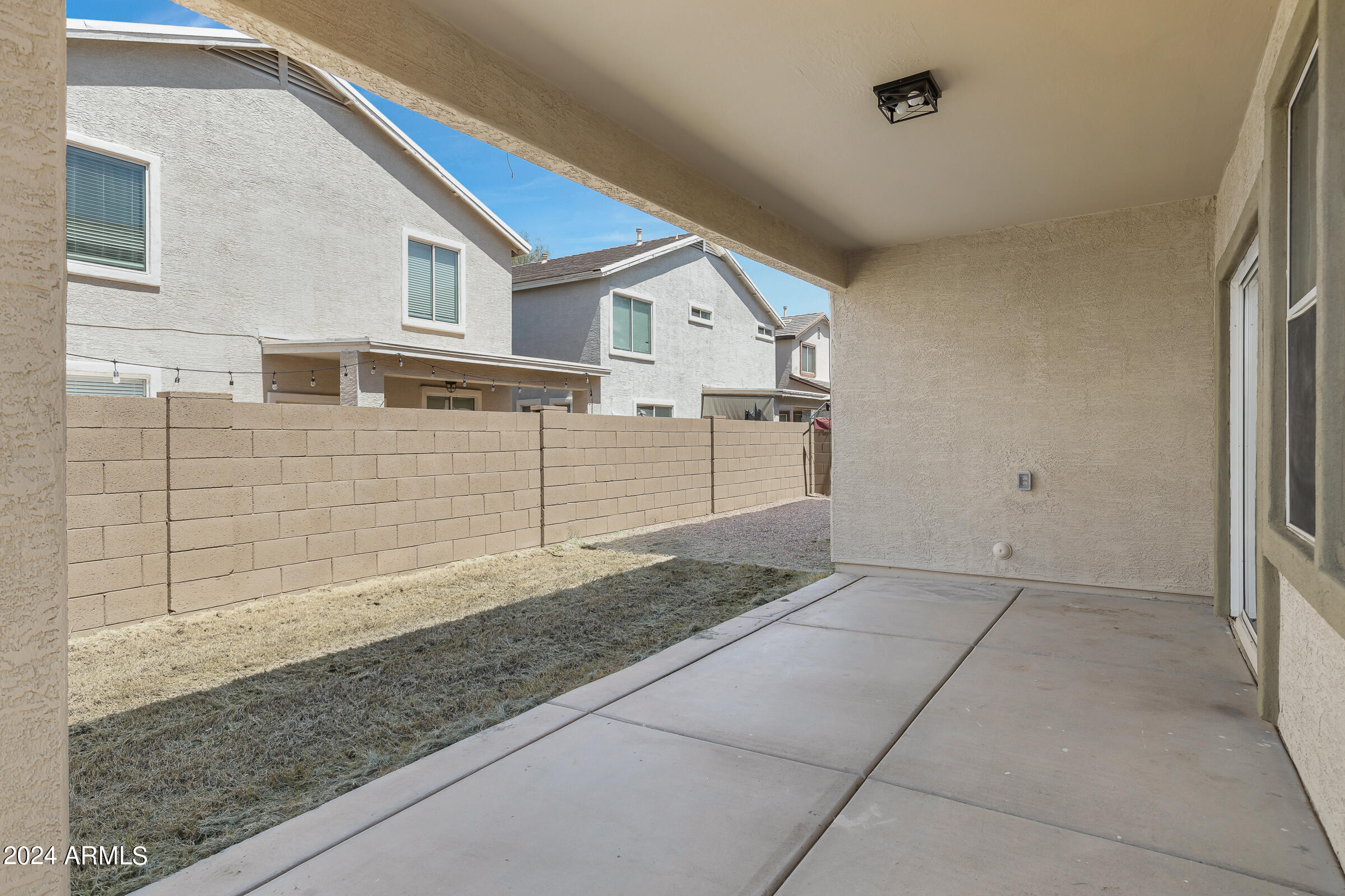 3910 West Carter Road Phoenix, AZ 85041 - Photo 39 of 40 a view of a house with a backyard