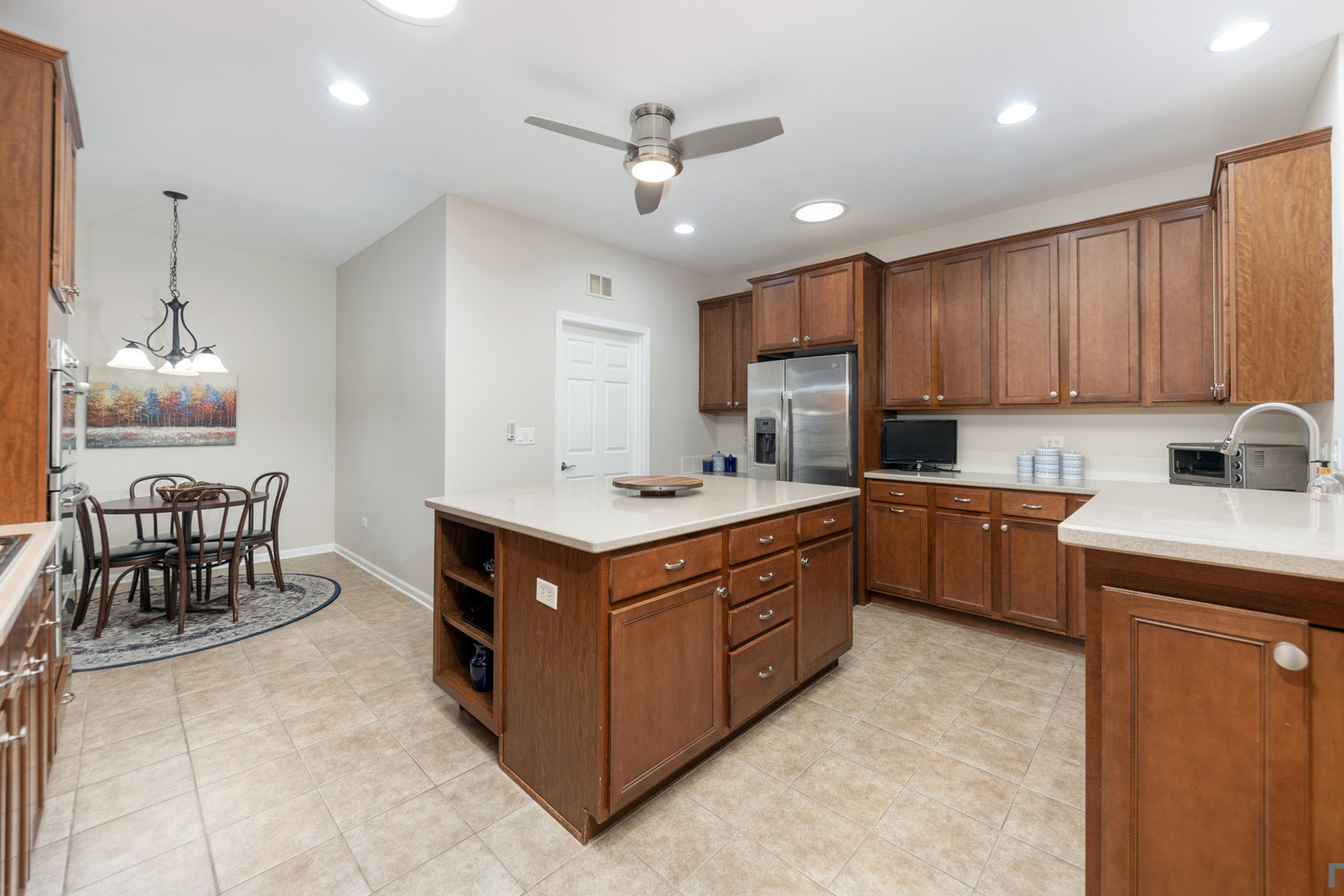 2852 Normandy Circle Naperville, IL 60564 - Photo 12 of 31 a kitchen with a cabinets and chairs