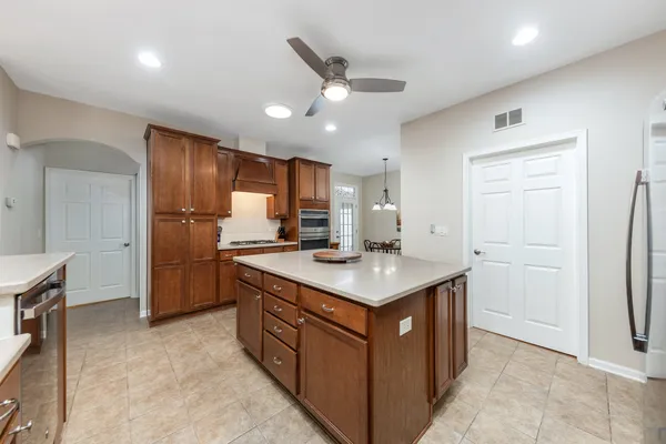 a kitchen with a sink a refrigerator and a stove