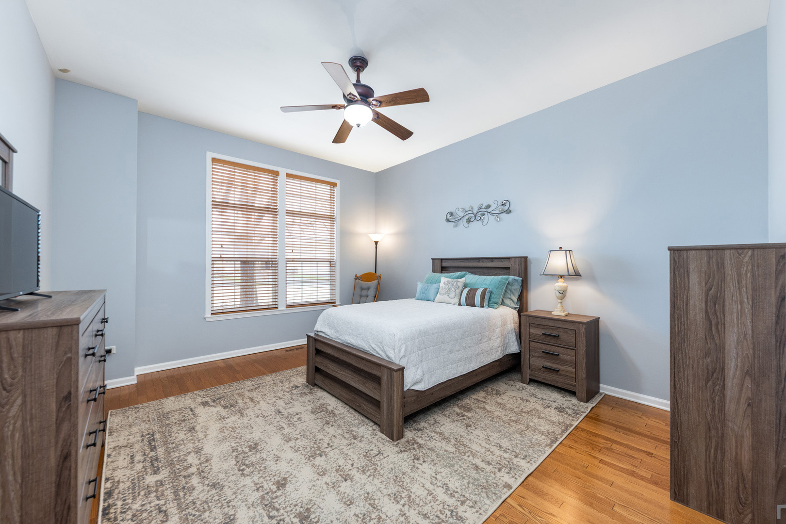 2852 Normandy Circle Naperville, IL 60564 - Photo 17 of 31 a spacious bedroom with a bed and a window