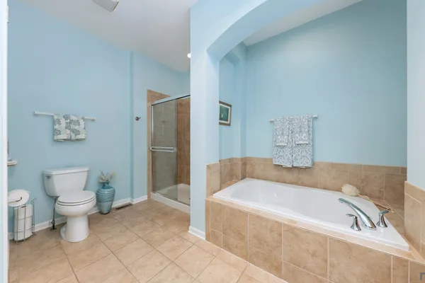 a bathroom with a bathtub and toilet