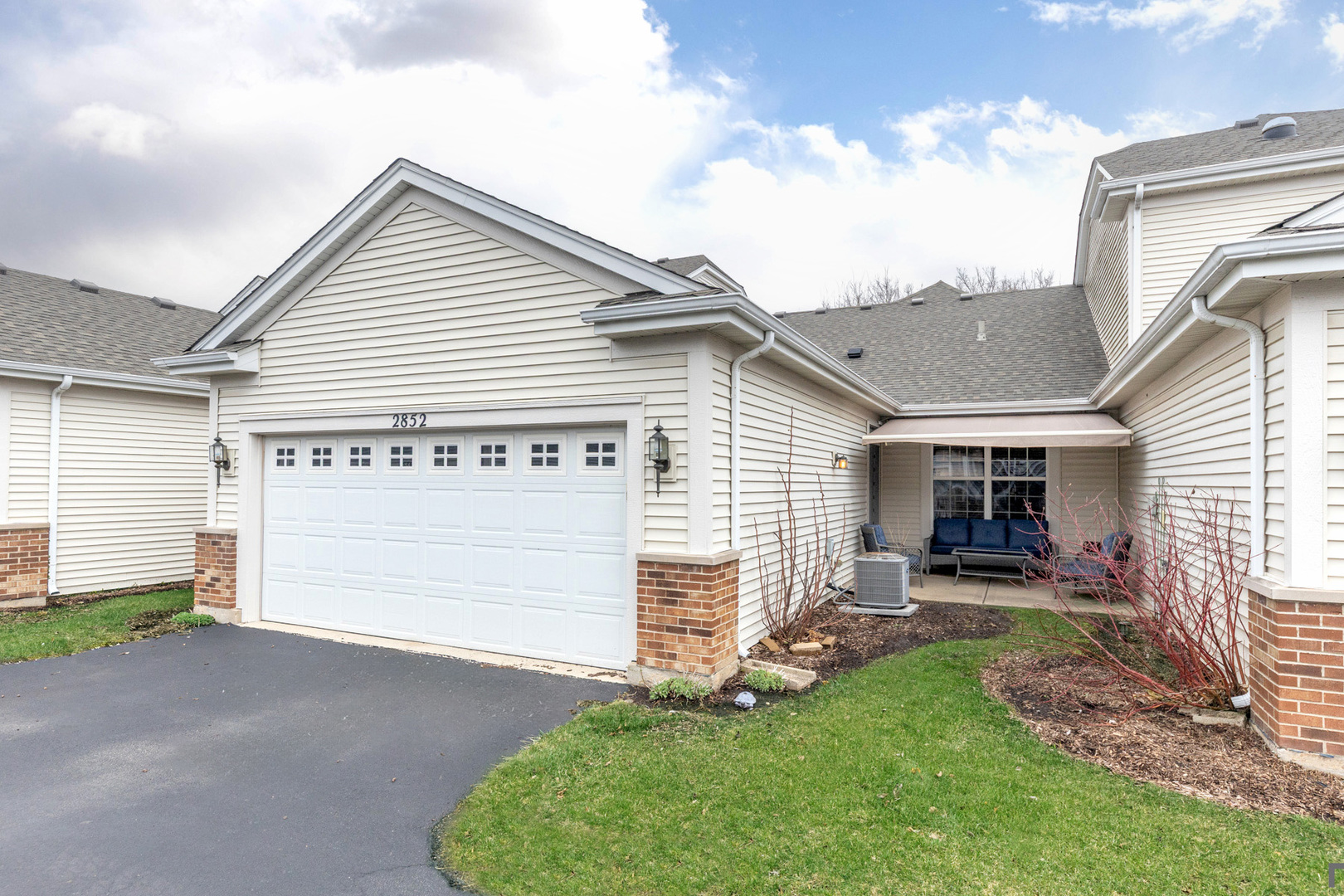 2852 Normandy Circle Naperville, IL 60564 - Photo 28 of 31 a view of a house with a patio and a yard