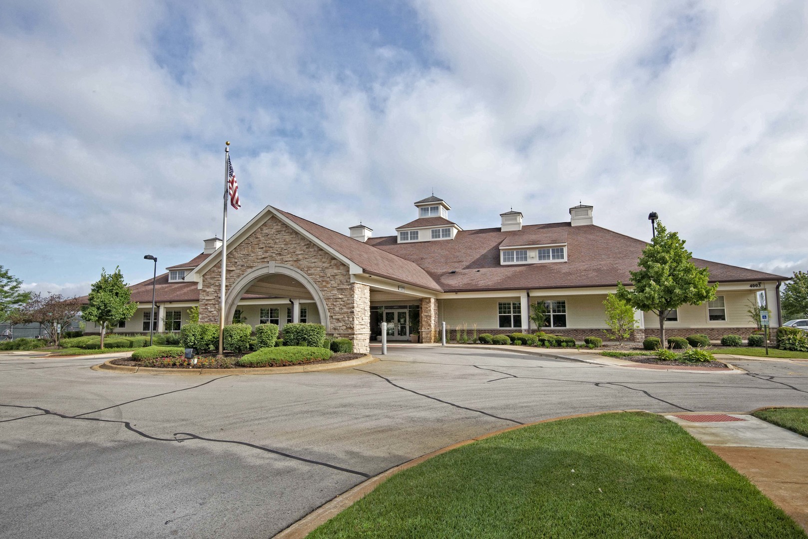 2852 Normandy Circle Naperville, IL 60564 - Photo 29 of 31 a front view of a building with lots of cars and trees