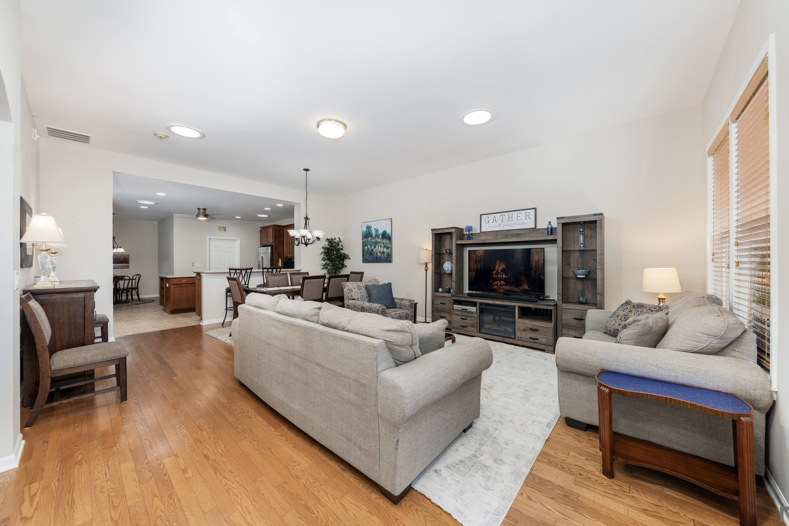2852 Normandy Circle Naperville, IL 60564 - Photo 5 of 31 a living room with furniture and a flat screen tv