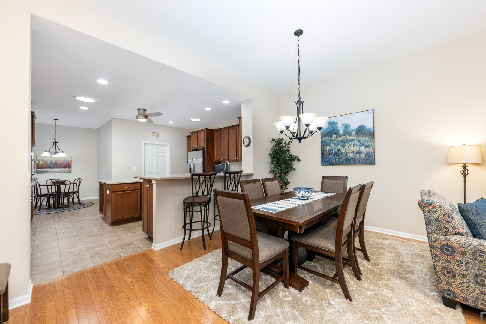 2852 Normandy Circle Naperville, IL 60564 - Photo 10 of 31 a dining room with furniture and a chandelier