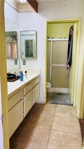 a bathroom with a double vanity sink and mirror