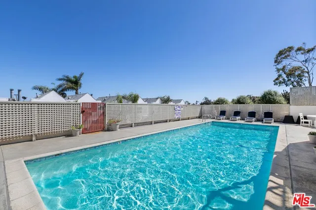 a view of a backyard with seating area
