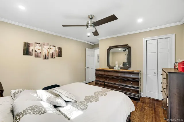 a bedroom with a bed and a dresser