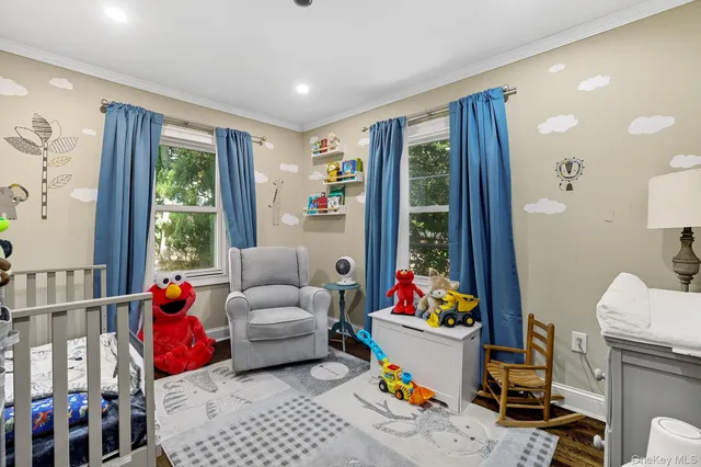 a living room filled with furniture toys and a window