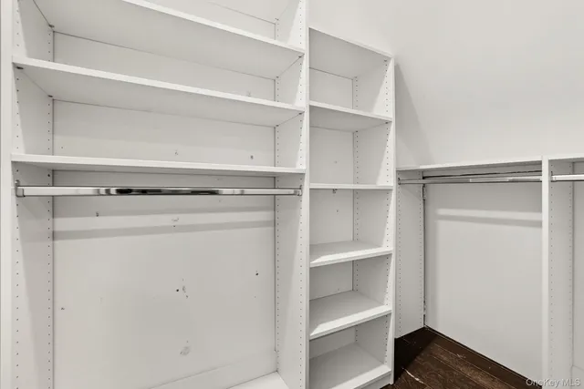 a view of an empty walk in closet