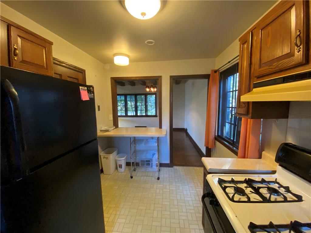5659 Darlington Road Pittsburgh, PA 15217 - Photo 17 of 25 a kitchen with a stove and a refrigerator