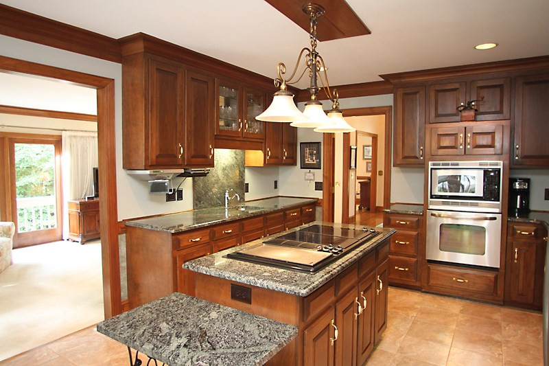 12332 Galway Drive Raleigh, NC 27613 - Photo 9 of 25 Another shot of the kitchen showing the wet bar / vegetable sink area and additional storage. Kitchen