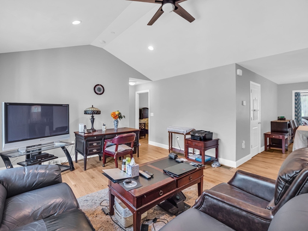 37 Abacoa Road, Unit 37 Hudson, NH 03051 - Photo 12 of 28 a living room with furniture and wooden floor