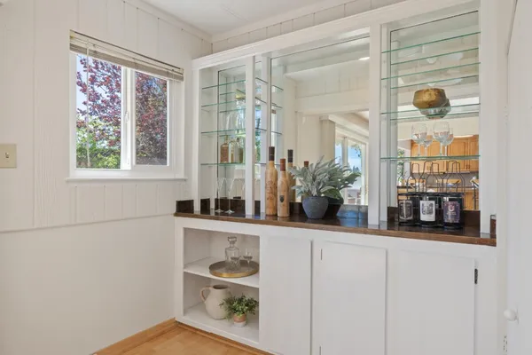 a room with a window and mirror