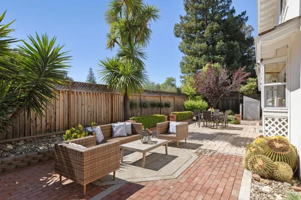 a view of a patio with couches and a fire pit