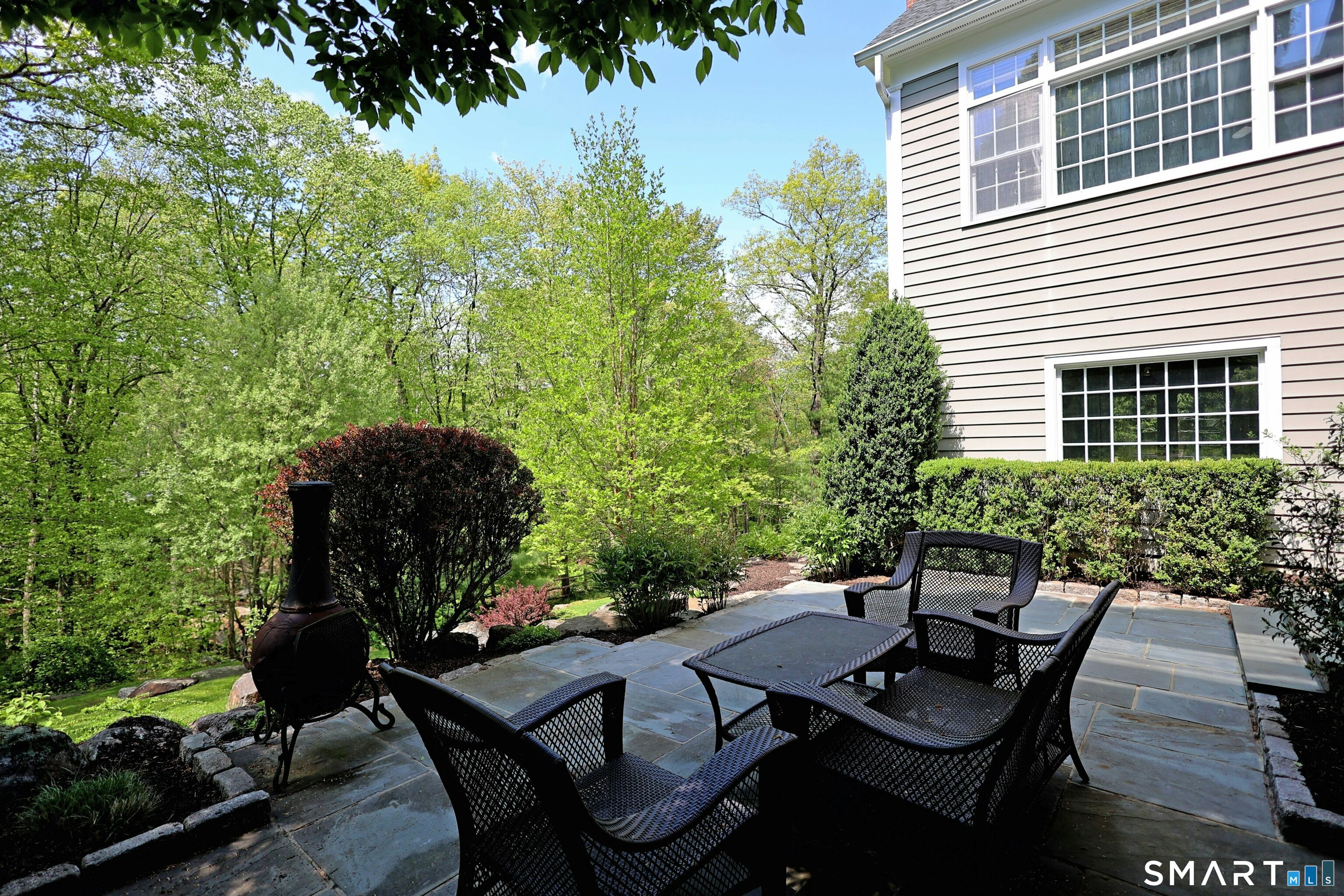 30 Whipstick Road Ridgefield, CT 06877 - Photo 7 of 40 a view of a backyard with sitting area and furniture