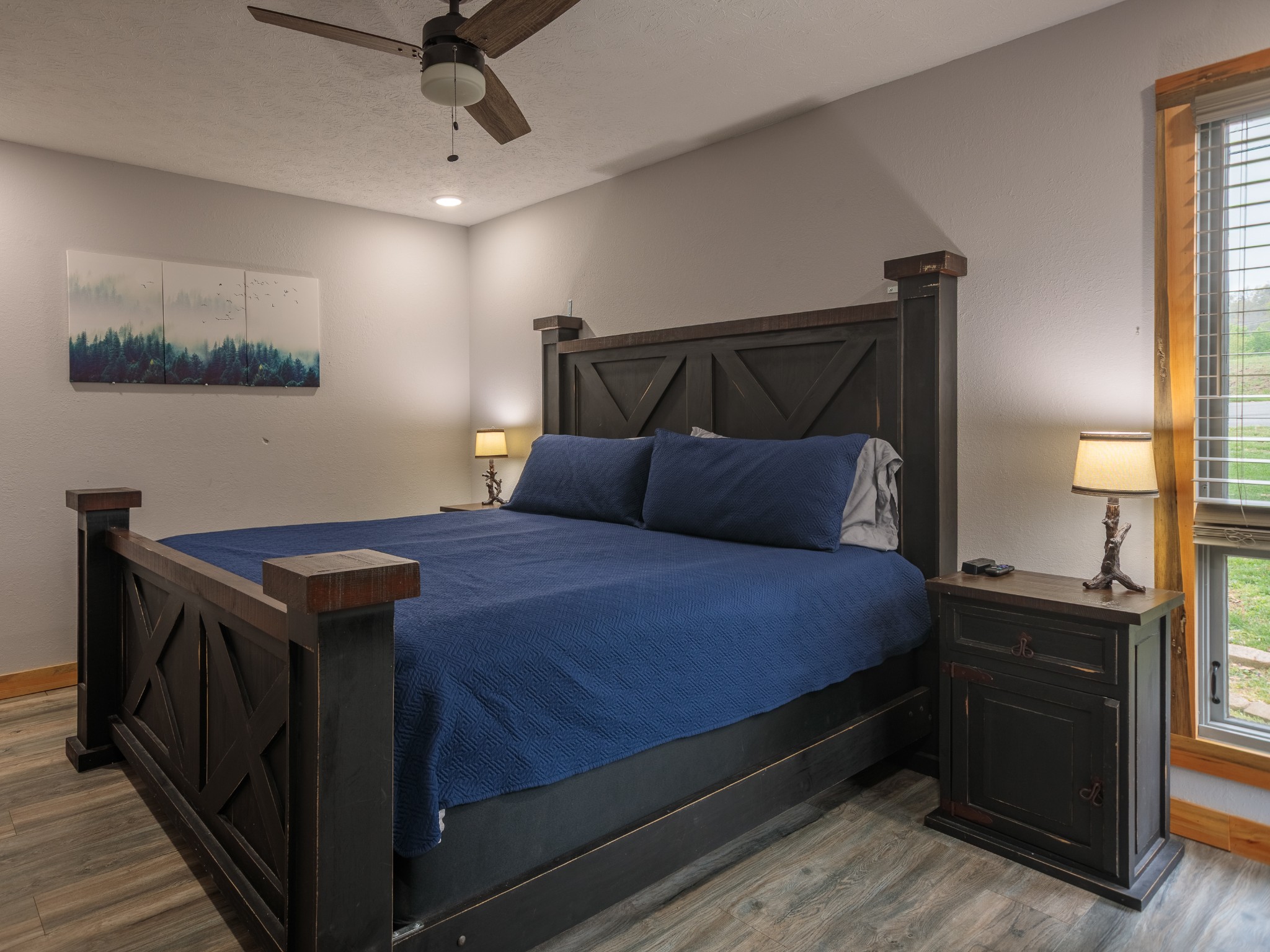 812 Starlight Lane Kodak, TN 37764 - Photo 15 of 60 a bedroom with a bed and a chandelier