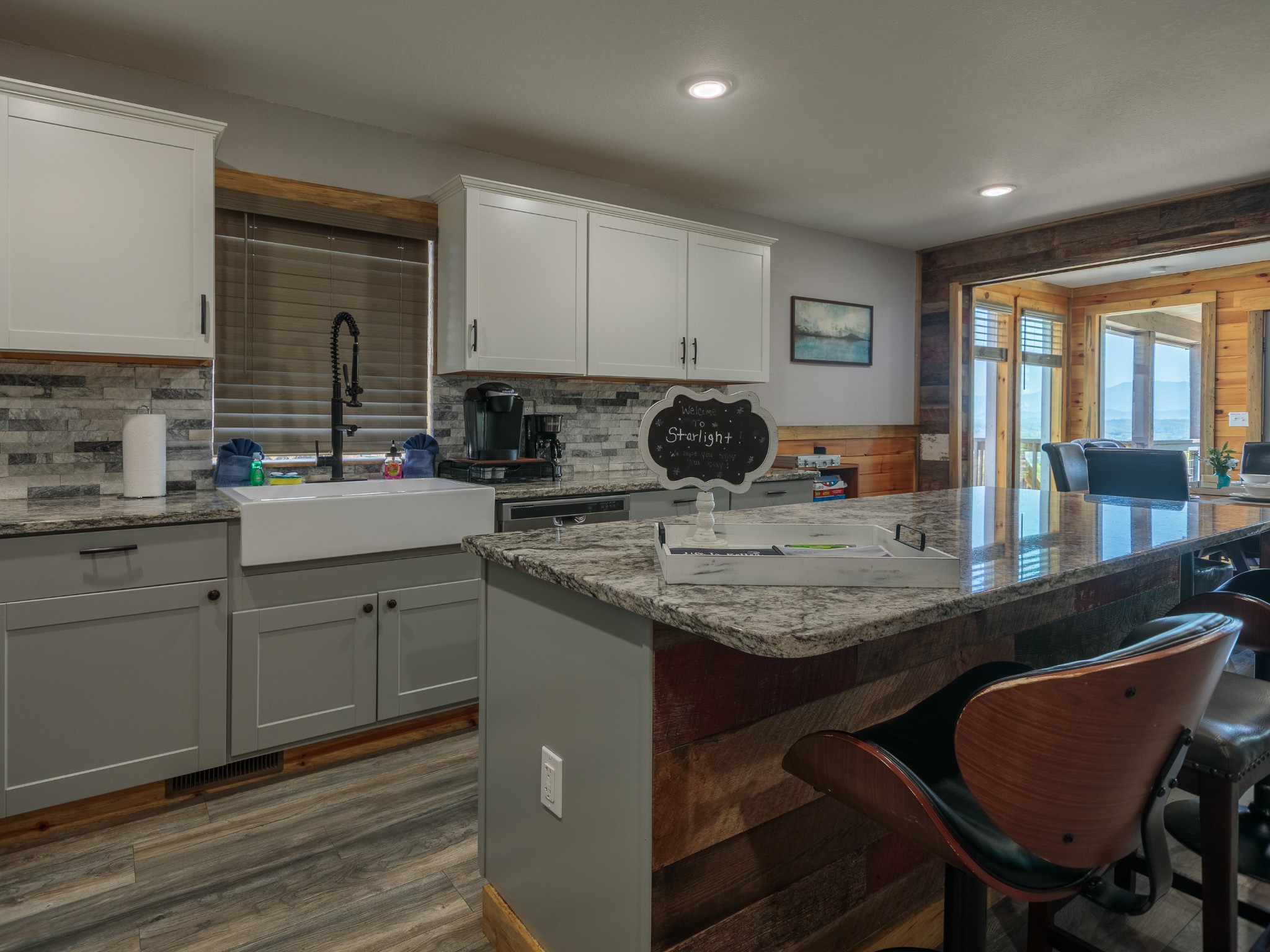 812 Starlight Lane Kodak, TN 37764 - Photo 17 of 60 a kitchen with a sink a stove and chairs