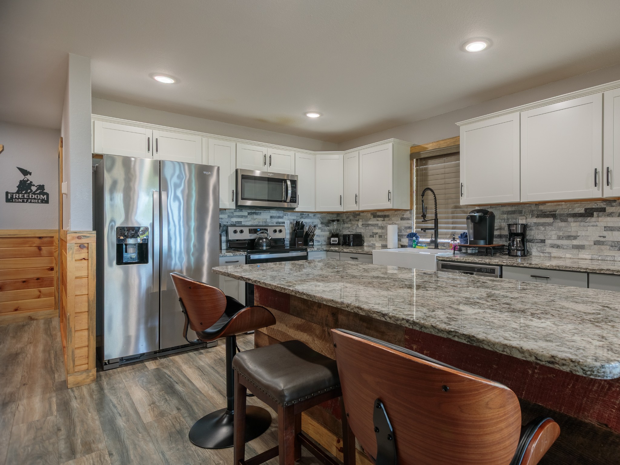 812 Starlight Lane Kodak, TN 37764 - Photo 19 of 60 a kitchen with a refrigerator a sink a stove a microwave and cabinets