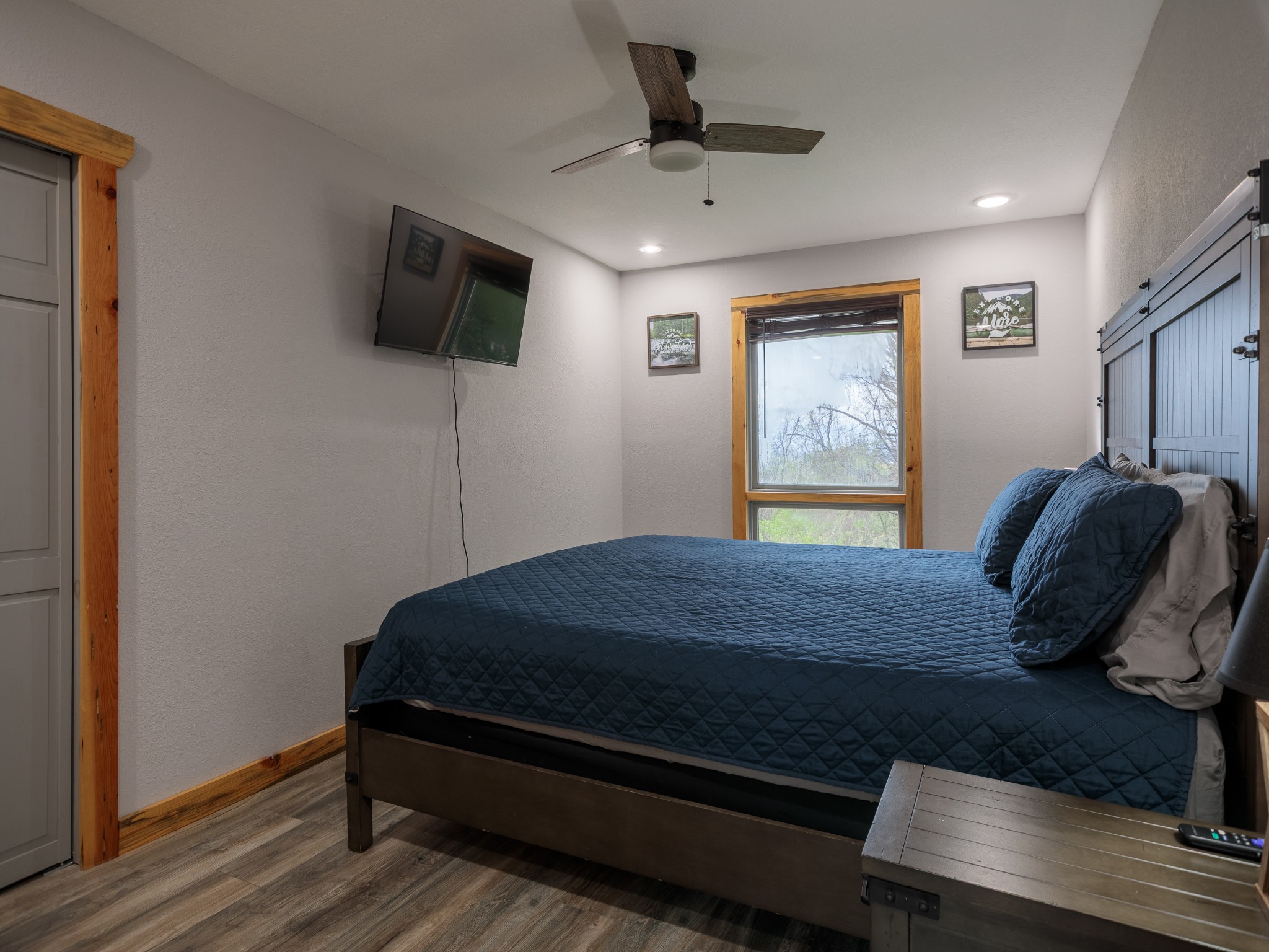 812 Starlight Lane Kodak, TN 37764 - Photo 30 of 60 a bedroom with a bed and a flat screen tv