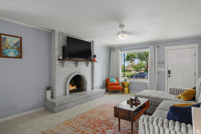 961 33rd Street Ogden, UT 84403 - Photo 8 of 39 Living area featuring a painted brick fireplace with a wood mantel