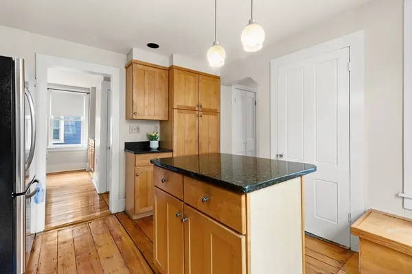 a view of kitchen with wooden floor and window