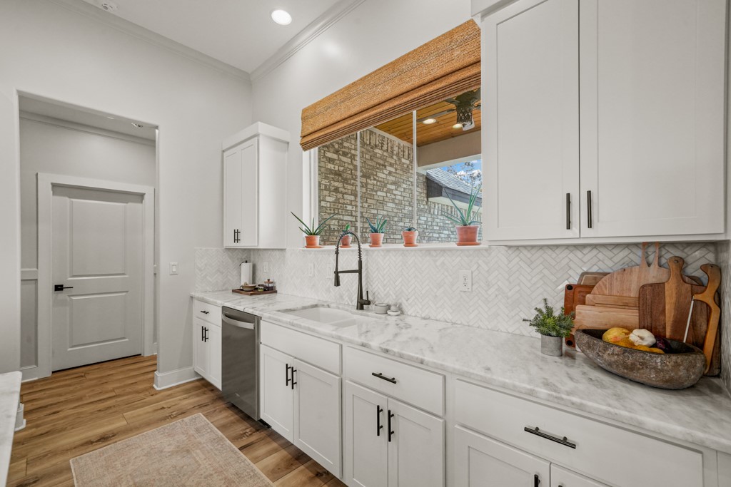 Undisclosed Address Spring Branch, TX 78070 - Photo 11 of 40 a kitchen with stainless steel appliances granite countertop a sink and cabinets with wooden floor