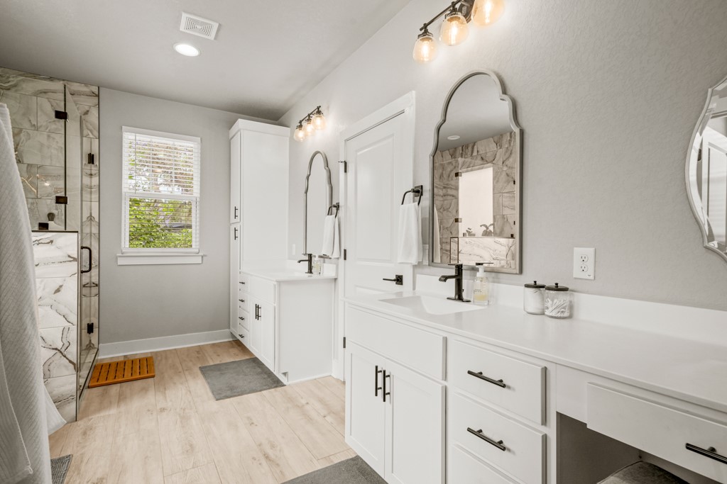 Undisclosed Address Spring Branch, TX 78070 - Photo 14 of 40 a spacious bathroom with double sink and a mirror