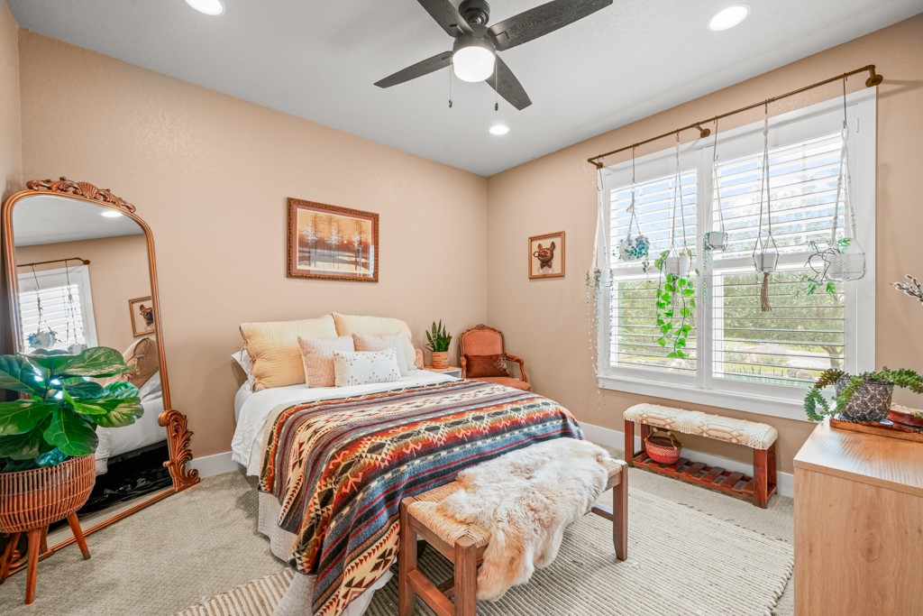 Undisclosed Address Spring Branch, TX 78070 - Photo 17 of 40 a bedroom with a bed and a couch