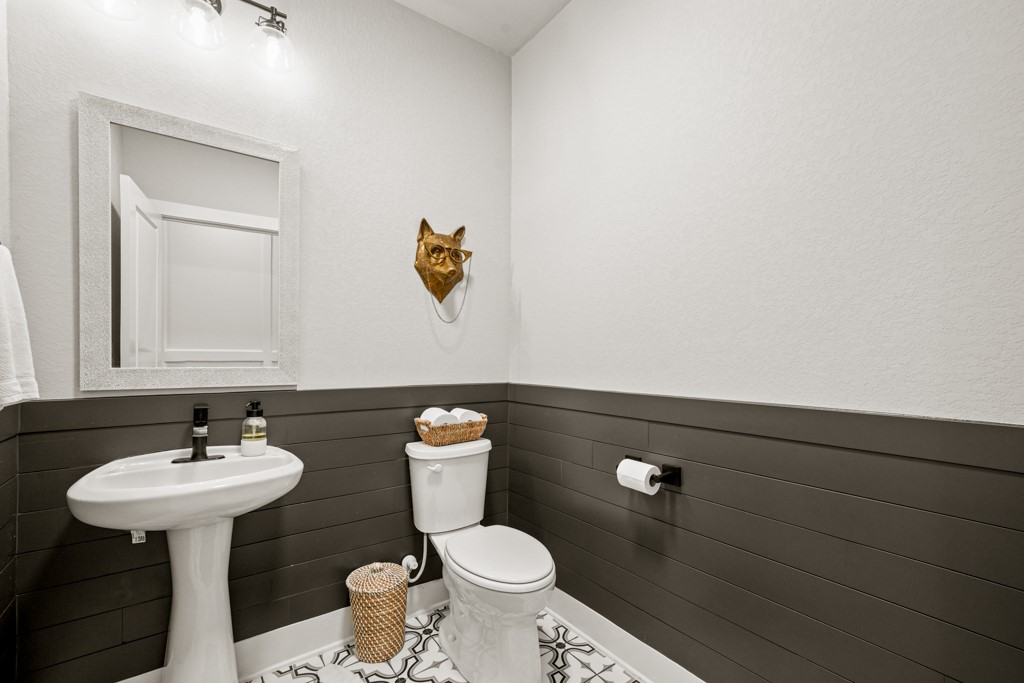 Undisclosed Address Spring Branch, TX 78070 - Photo 22 of 40 a bathroom with a sink toilet and a mirror