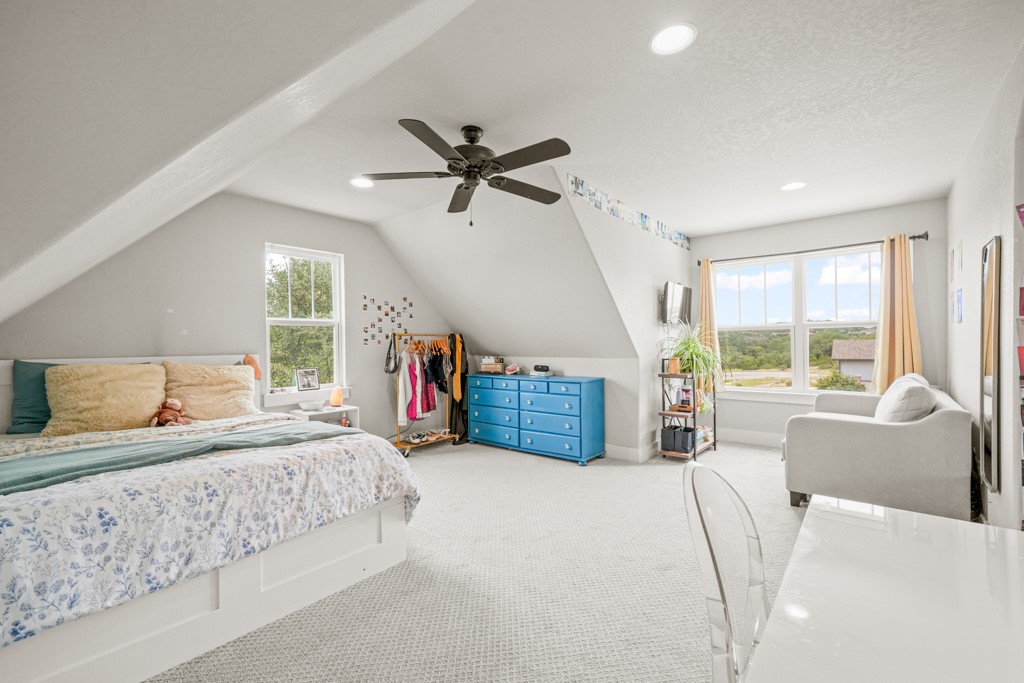 Undisclosed Address Spring Branch, TX 78070 - Photo 24 of 40 a bedroom with a large bed and a large window