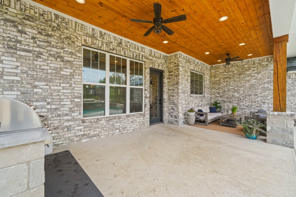 Undisclosed Address Spring Branch, TX 78070 - Photo 26 of 40 a view of a patio with table and chairs and potted plants