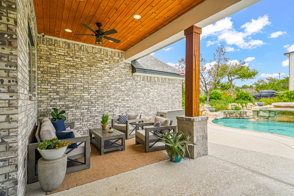 Undisclosed Address Spring Branch, TX 78070 - Photo 27 of 40 a view of a patio with table and chairs and potted plants
