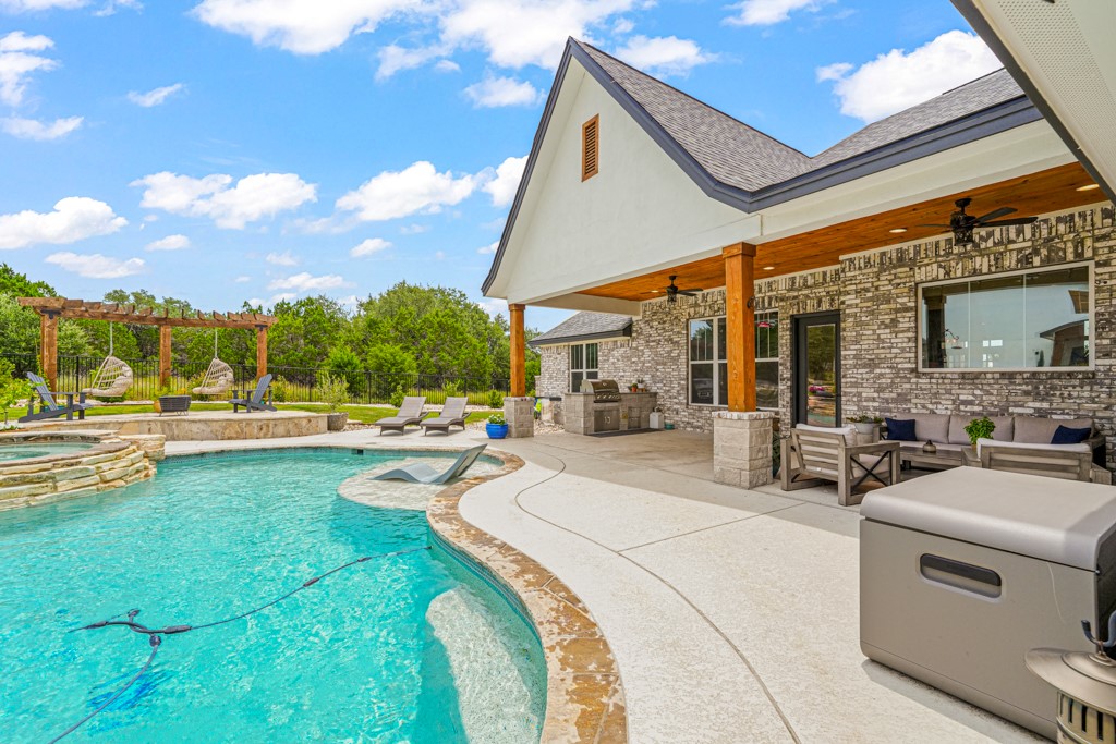 Undisclosed Address Spring Branch, TX 78070 - Photo 28 of 40 a view of swimming pool with outdoor seating and a yard
