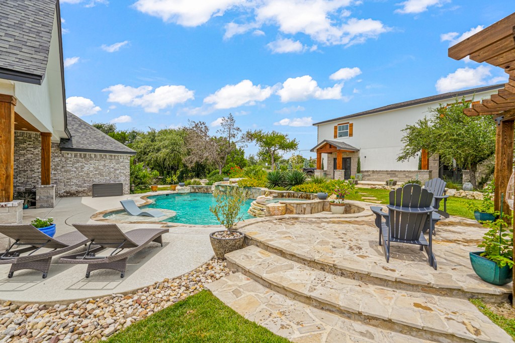 Undisclosed Address Spring Branch, TX 78070 - Photo 30 of 40 a view of backyard with swimming pool and outdoor seating