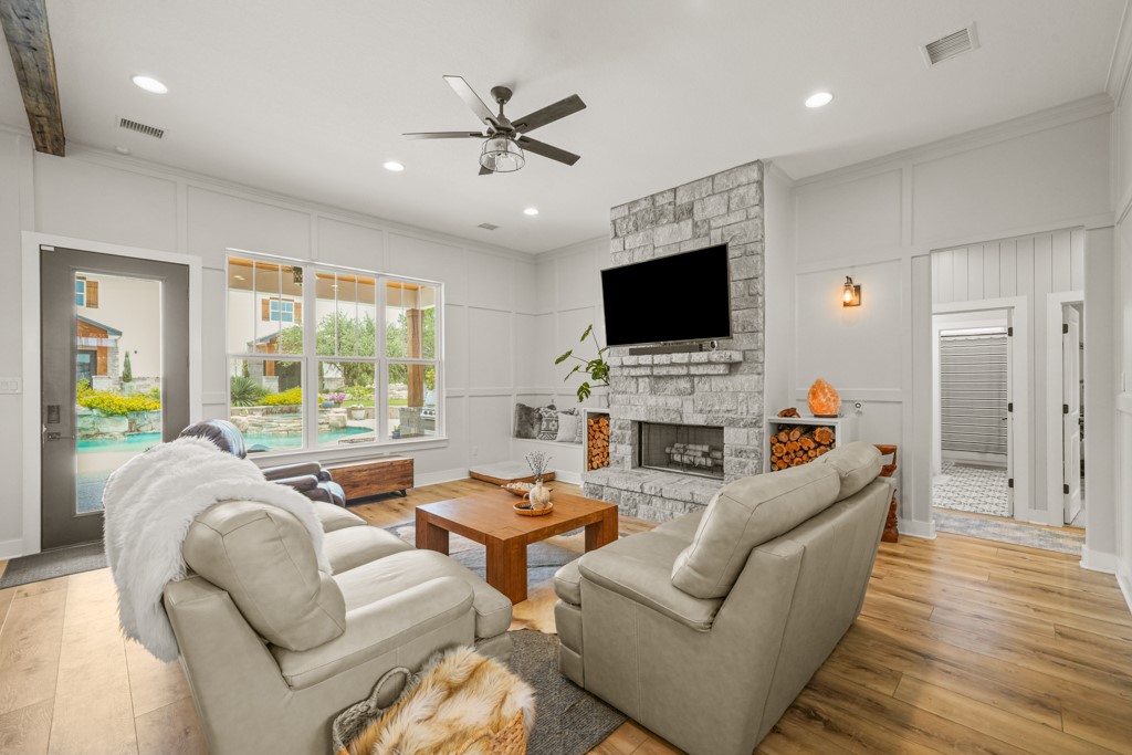 Undisclosed Address Spring Branch, TX 78070 - Photo 6 of 40 a living room with furniture a fireplace and a flat screen tv