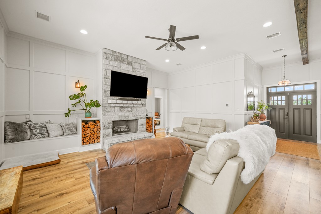 Undisclosed Address Spring Branch, TX 78070 - Photo 7 of 40 a living room with furniture a fireplace and a flat screen tv