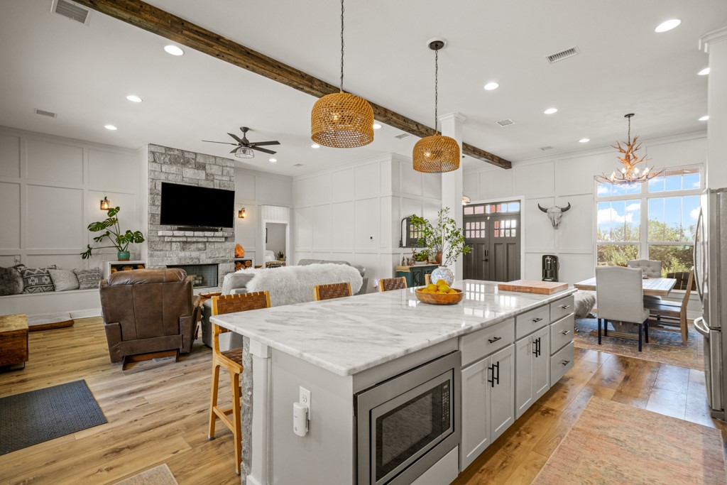 Undisclosed Address Spring Branch, TX 78070 - Photo 8 of 40 a view of a kitchen and sink with wooden floor