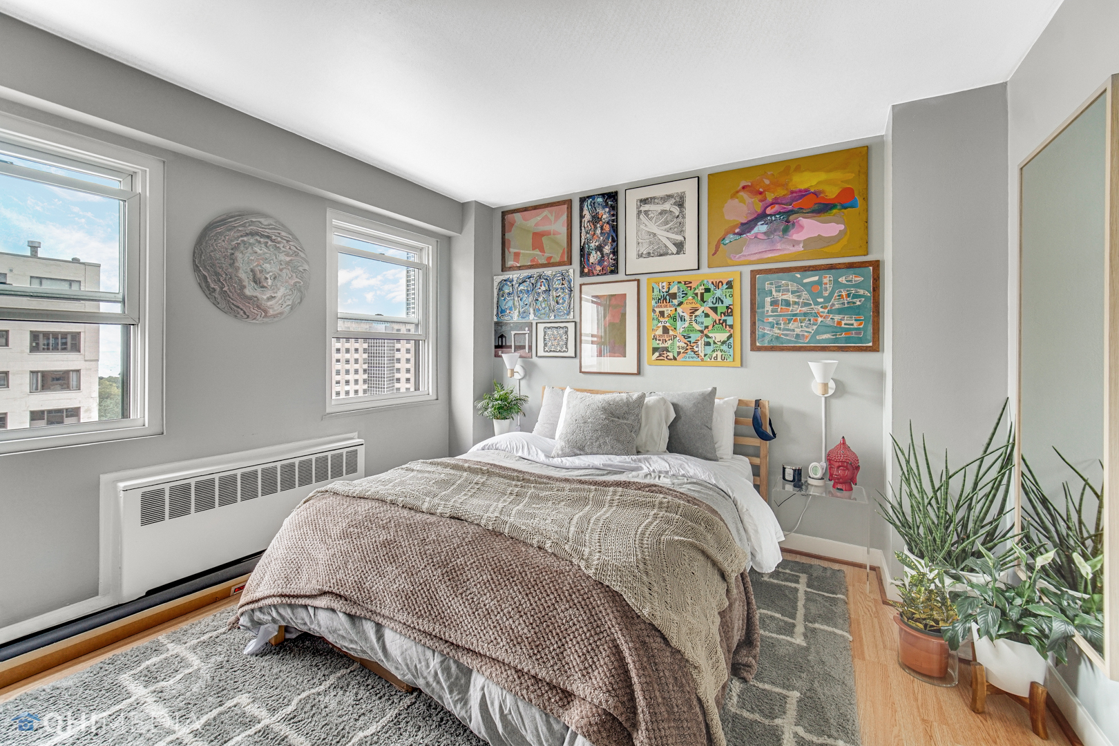 2909 North Sheridan Road, Unit 1502 Chicago, IL 60657 - Photo 13 of 19 a bed sitting in a bedroom next to a window