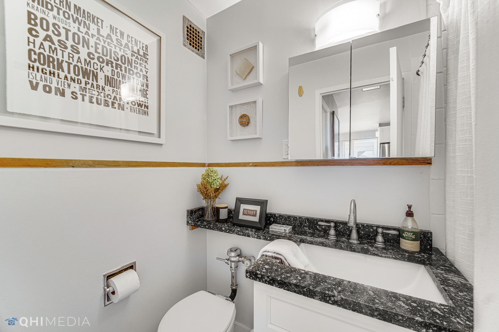 2909 North Sheridan Road, Unit 1502 Chicago, IL 60657 - Photo 15 of 19 a bathroom with a granite countertop sink mirror vanity and toilet